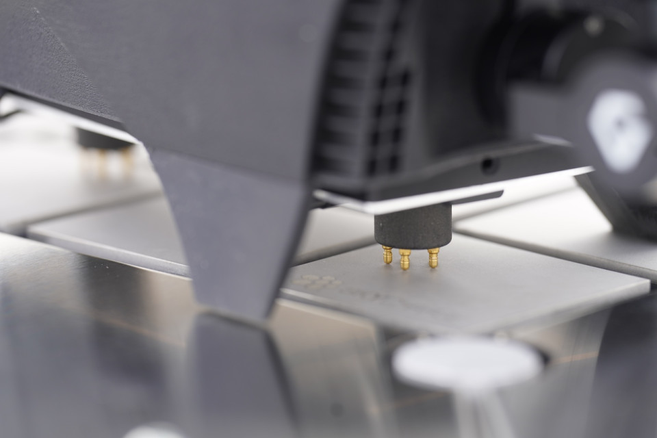 Closeup of a drone landing on a charging connector