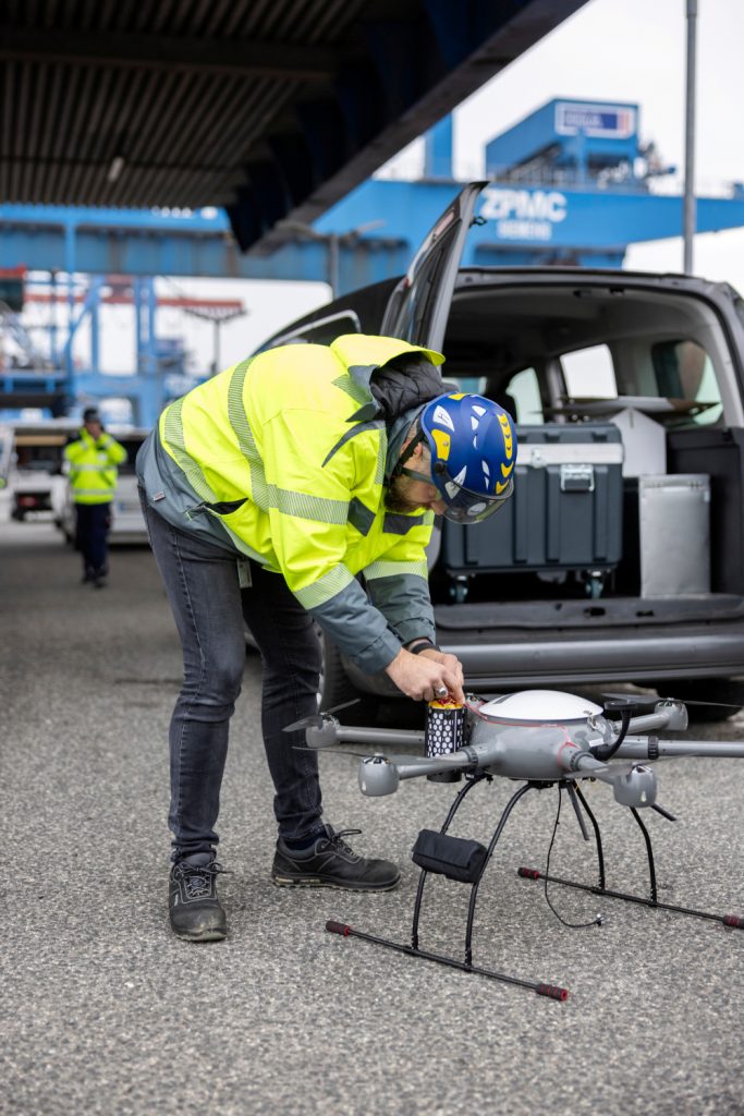 Person working on a drone at the terminal